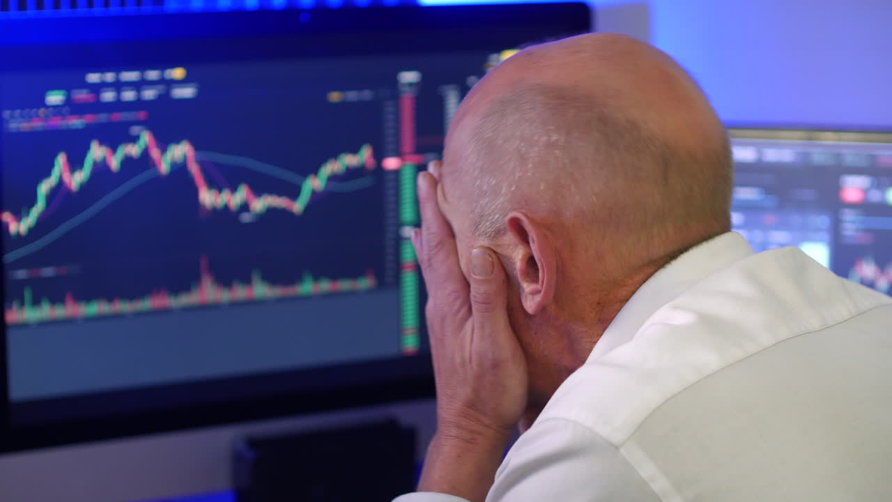 Stressed businessman loses money on stock market