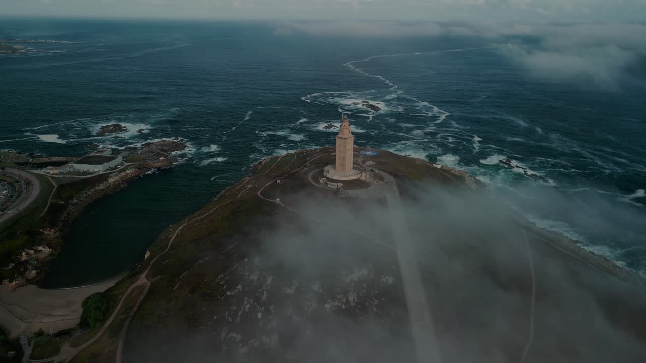 Aerial View, Tower Of Hercules Lighthouse In Coruna Spain, Coastal Landmark With Clouds and Haze