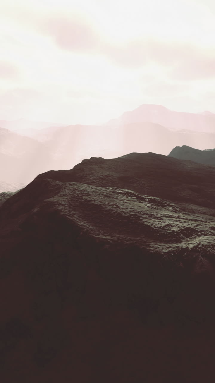 Majestic mountains basking in soft sunlight during early morning hours