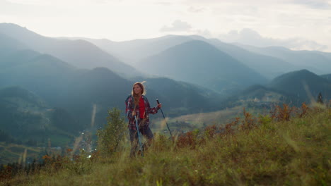 backpacking woman explore mountains peak. hiking tourist walk mountains nature.