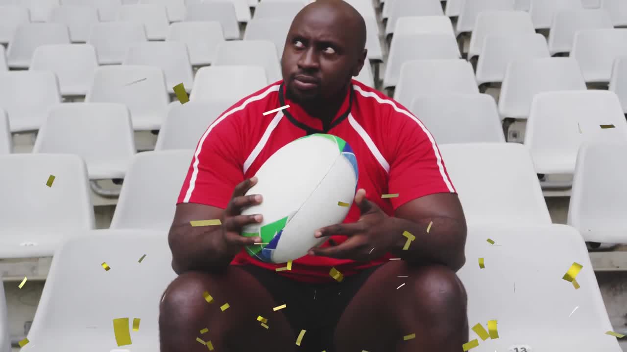 Animazione di coriandoli dorati che cadono su un giocatore di rugby maschio afroamericano seduto