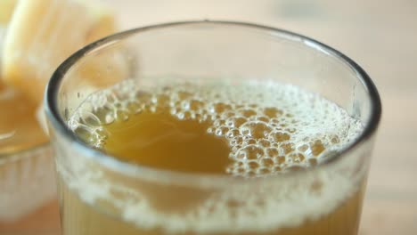 Close-up of a glass of tea with bubbles