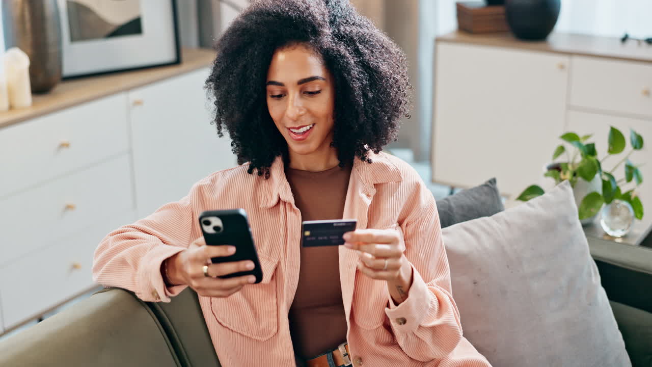 Woman using mobile phone at home