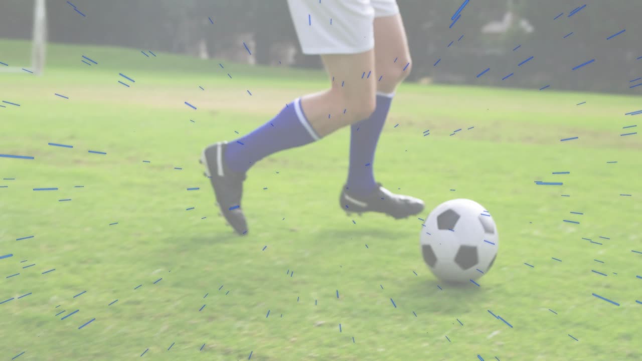 Soccer player legs entering grass field and using alternating touches guiding ball during training