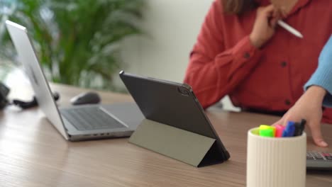 businesswomen using tablet in office meeting