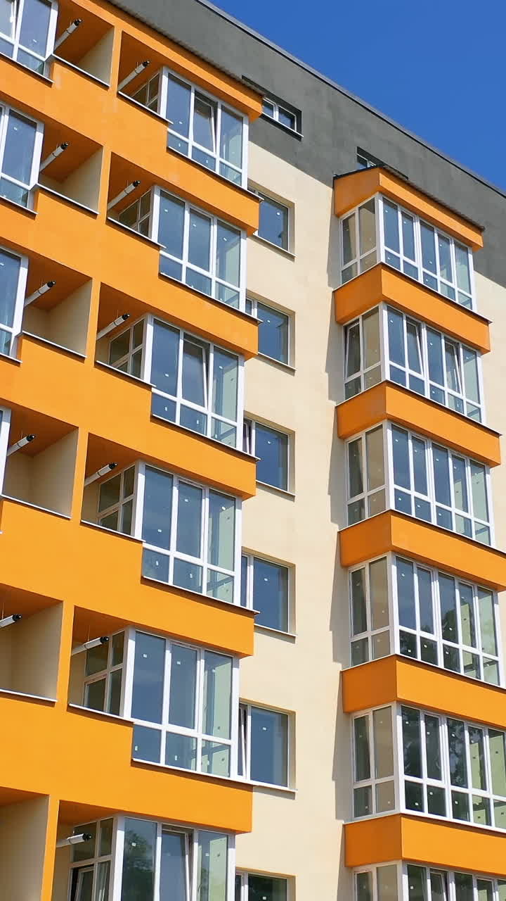New modern apartment building. Aerial view of new house city multi-story apartment building. Vertical video