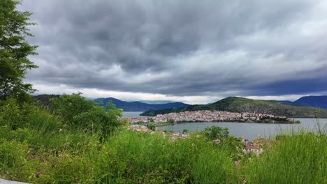 Driving-overlooking-Kastoria,-Greece-and-lake-Orestiada,-panorama-view-of-city