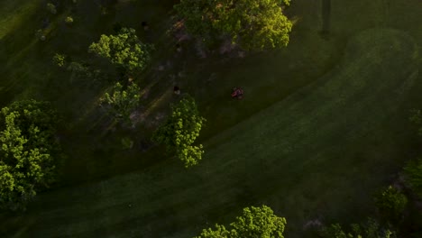 mowing lawn with tractor in countryside