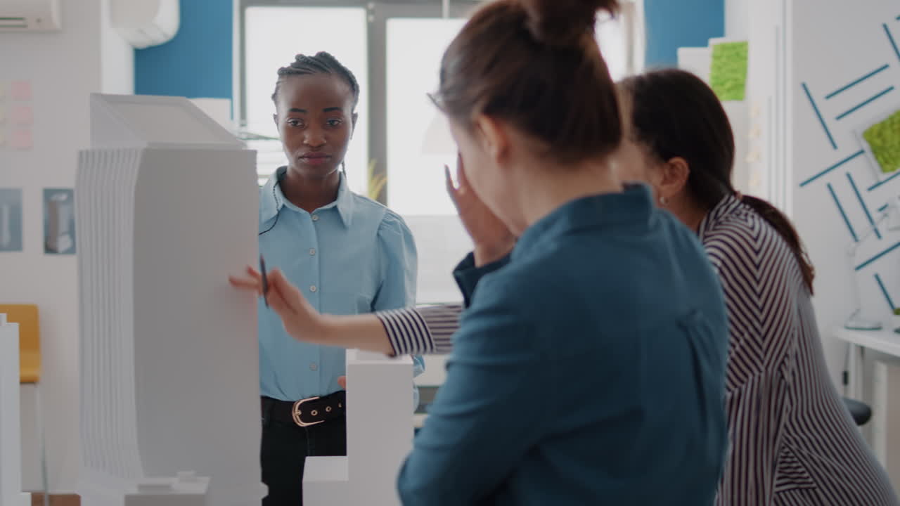 Architects Discussing Skyscraper Model