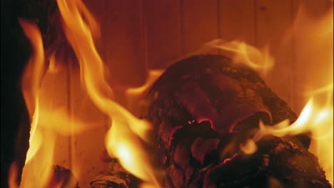 Close-up-shot-of-Burning-Flame-At-Fireplace-on-wooden-logs