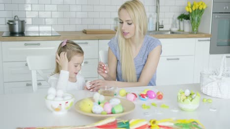 Mother-and-daughter-coloring-eggs