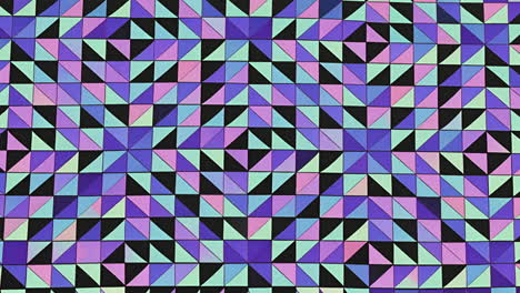 geometric pattern with colorful triangles creating kaleidoscopic animation effect