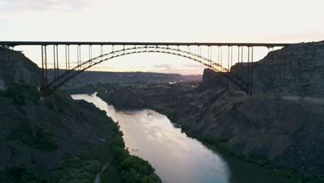 a 4k fly-over drone shot of perrine bridge, a 1,500 foot long bridge, spanning over the snake river in twin falls, idaho