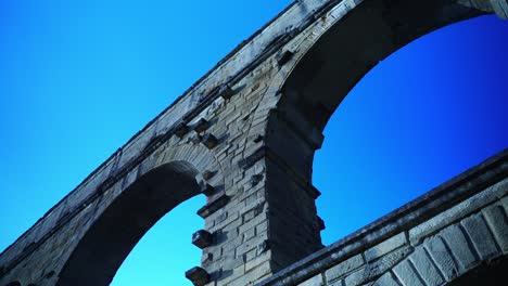 great stone arches of the pont du gard in france - a historic aqueduct of the framers