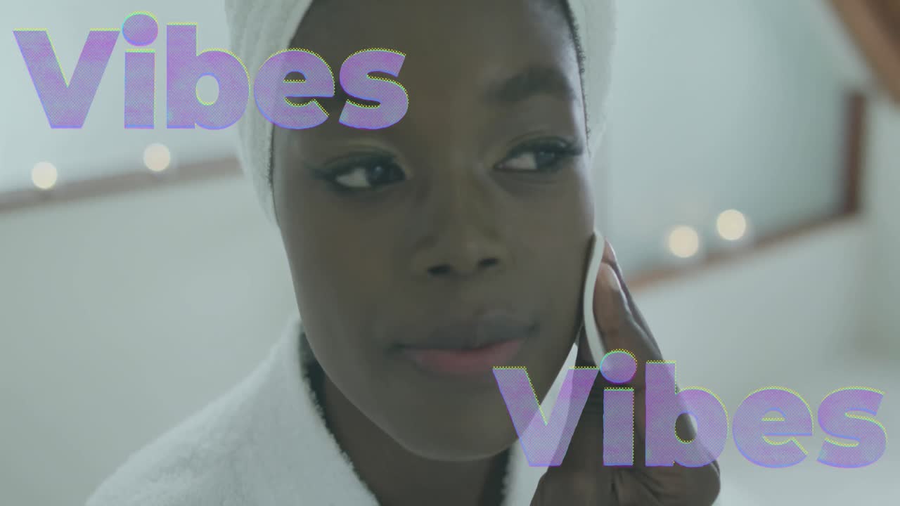 Animation of vibes text in lilac over happy african american woman cleansing face at home