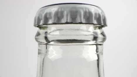 close-up of sealed glass beer bottle, macro shot static