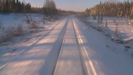 pov from the front of a train passing through a snowy landscape 6