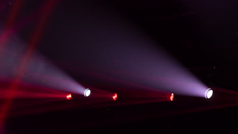 Red-and-white-stage-lights-mounted-on-the-top-lit-the-dark-room-with-bright-colors