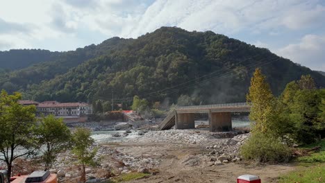 Collapsed-bridge-at-Romagnano-Sesia,-Italy.-pan-left