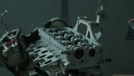 open car engine close-up. an auto mechanic in a garage repairing a car engine after removing a cover. car engine repair. car service