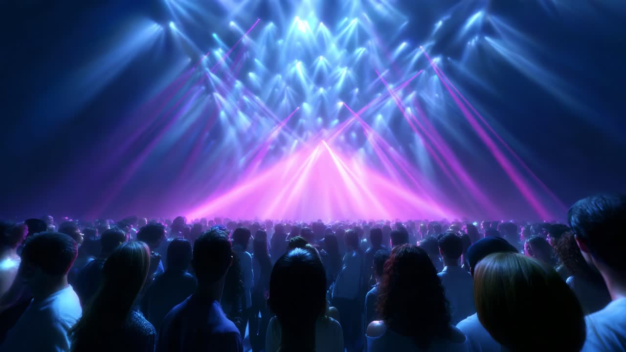 A Thrilling Spectacle of Light and Sound: Spectators Stand Enthralled Before an Enormous Stage Illuminated by Vibrant Beams of Colorful Lights Creating an Exhilarating Atmosphere of Excitement and Anticipation