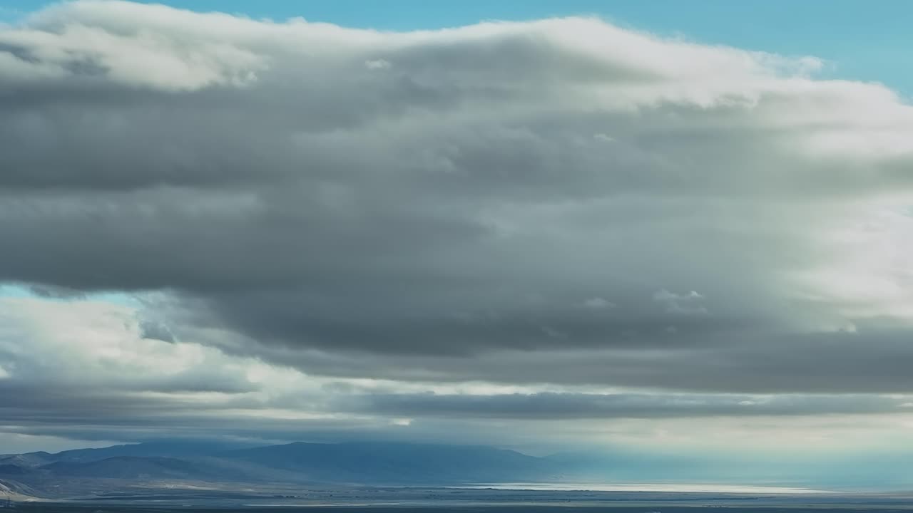 Clouds cover the sky over mountains and bodies of water in USA