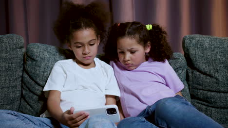 kids sitting on the sofa at home