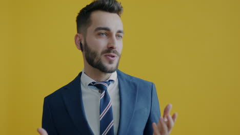 businessman in a suit, yellow background