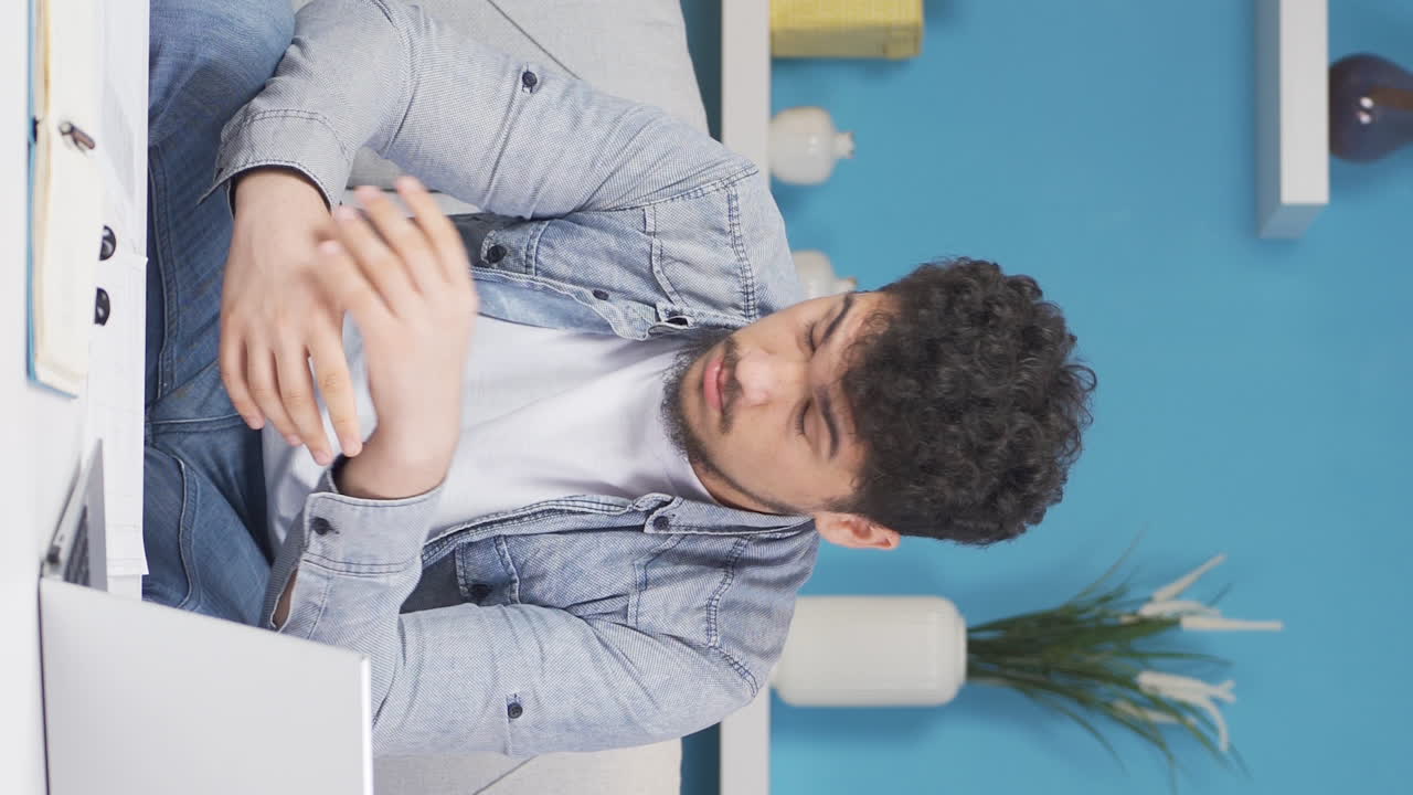Vertical video of Tired And Sleepy Man.