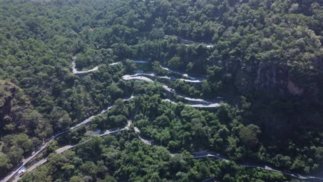 Drone-shot-of-Pollachi-To-Valparai-scenic-route-road-trip,-Coimbatore,-Tamil-Nadu,-South-India