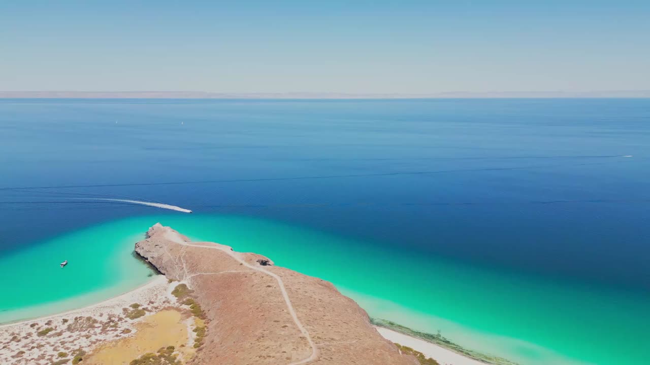 Peaceful aerial view of a coastline in La Paz, Tecolotito, Mexico, with clear waters
