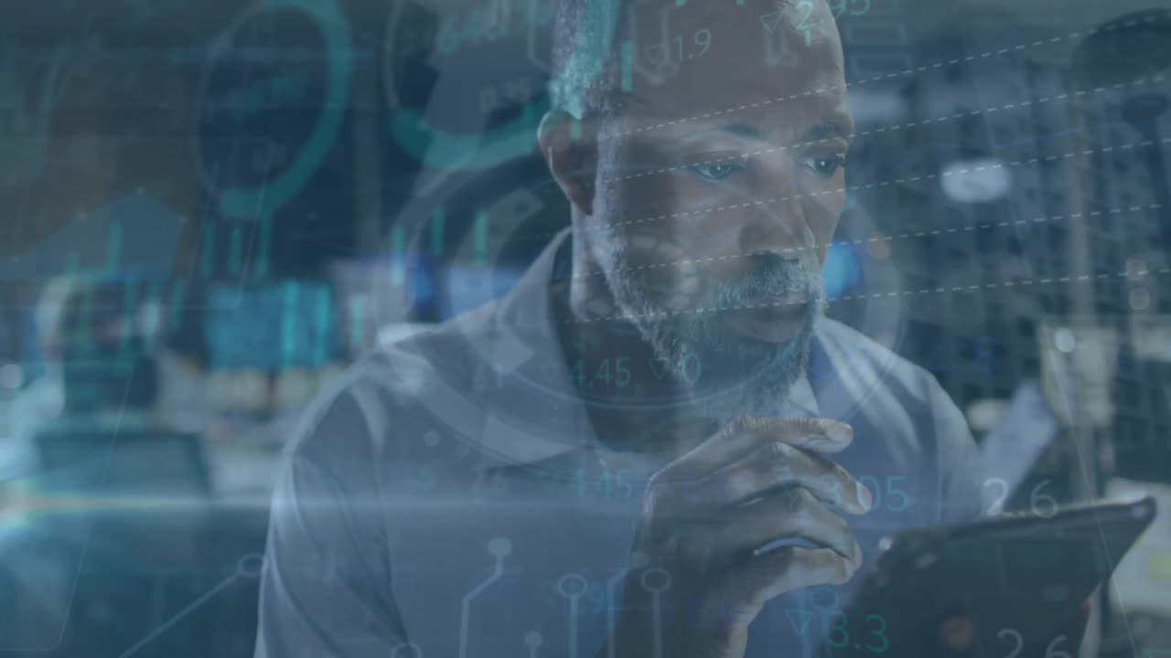 Animation of data processing over businessman using tablet in office