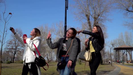 teenagers walks in park and sings to the beat of music