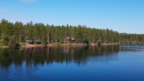 calm lake with reflections - lake busjon, appelbo, dalarna, sweden - aerial drone shot