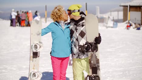 romantic young couple enjoying a public kiss