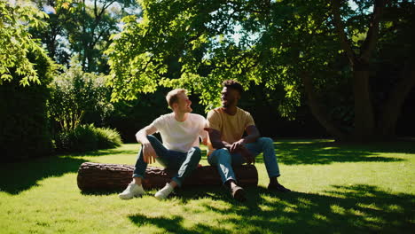 two friends having a conversation in a sunny park