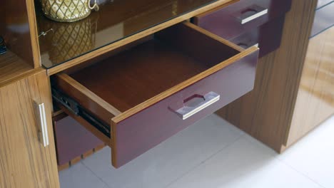 open drawer of a wooden cabinet