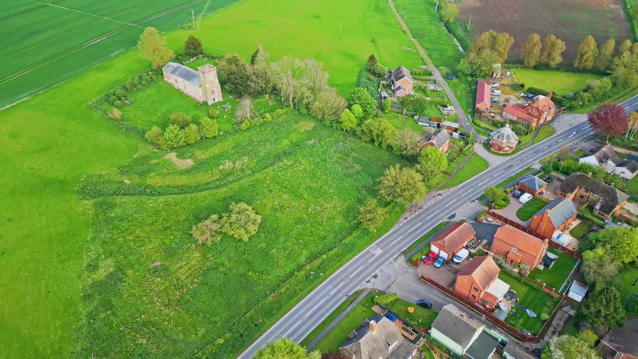 Captured by drone, Burwell village was a medieval market town with country fields, aged red brick houses, and the abandoned Saint Michael parish church on Lincolnshire's Wold Hills