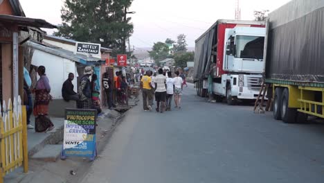 busy madagascan street scene. wide shot along road