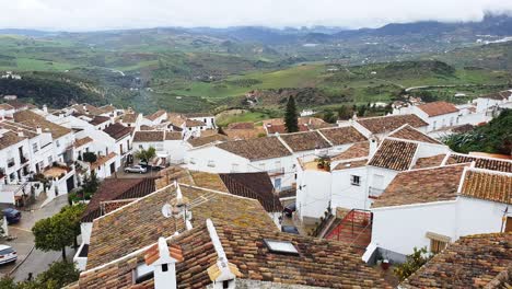 spain, andalusia, province of cadiz, village of grazalema with view of the penon grande rocky outcrop