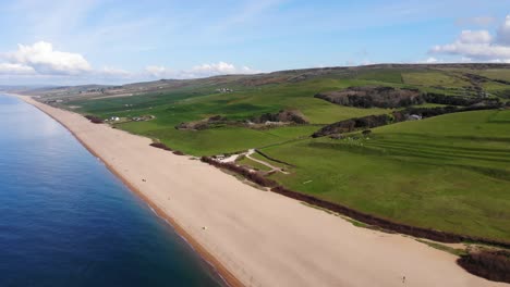 beautiful aerial shot over an empty chesil beach on the coast of dorset, england