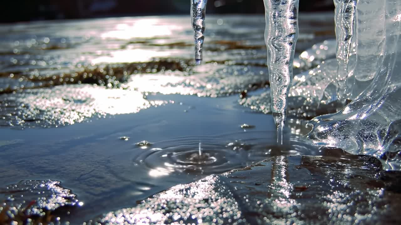 Ice Melts and Creates Ripples in Shallow Water on a Sunny Day by the Lake
