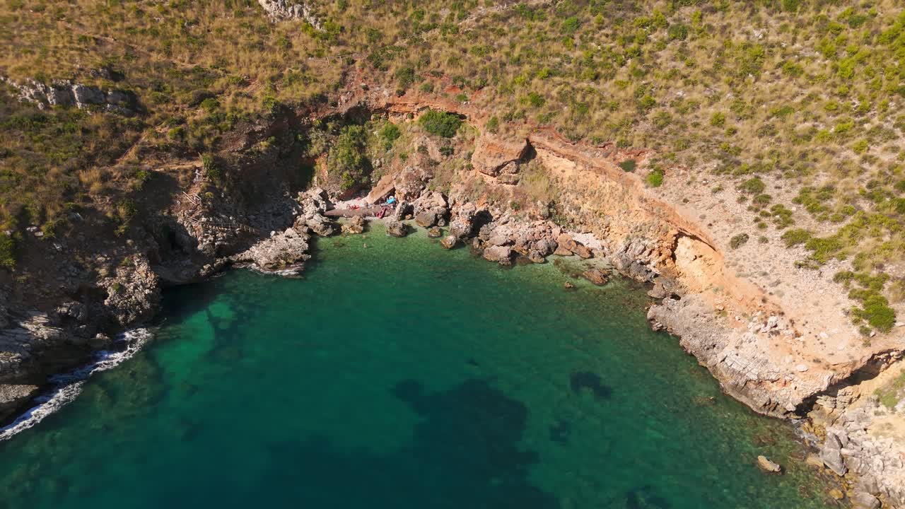 Aerial view of Cala Rossa in Sicily. Pristine waters, rugged coast. Travel vibes