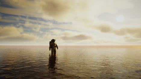 spaceman in the sea under clouds at sunset