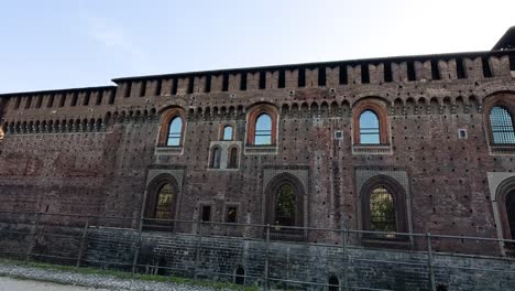 two people walking by sforzesco castle