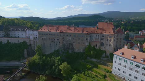 Great-aerial-top-view-flight-Krumlov-Cesky-castle-on-the-hill-castlein-in-czech-republic-in-Europe,-summer-of-2023