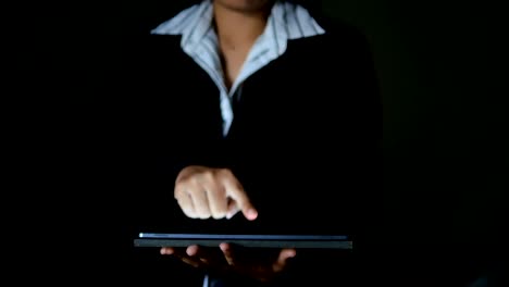 Business woman using tablet dark and grain processed