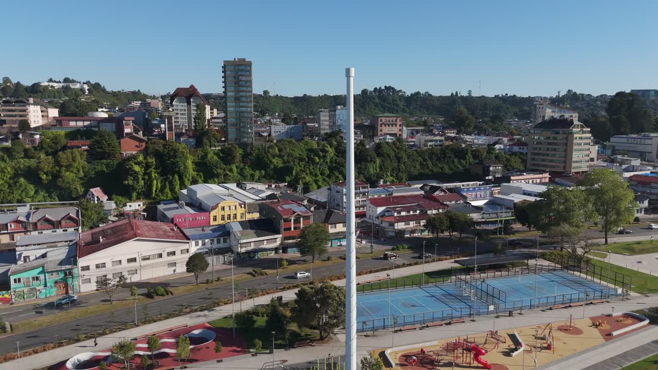 Aerial view of Puerto Montt in Chile, featuring the waterfront, cityscape, coastline, Reloncavi Sound and Osorno Volcano. Circle Dolly