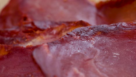 Seasoned-and-air-dried-pork-loin-slices,-very-close-up-view-in-4k