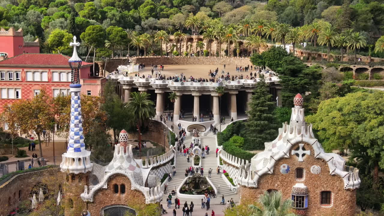 Aerial drone view of Barcelona, Spain. Park Guell with tourists, a lot of greenery